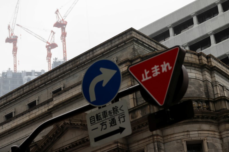 Traffic signs are seen in front of the headquarters of
