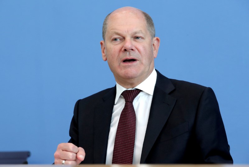 German Finance Minister Olaf Scholz attends a news conference in