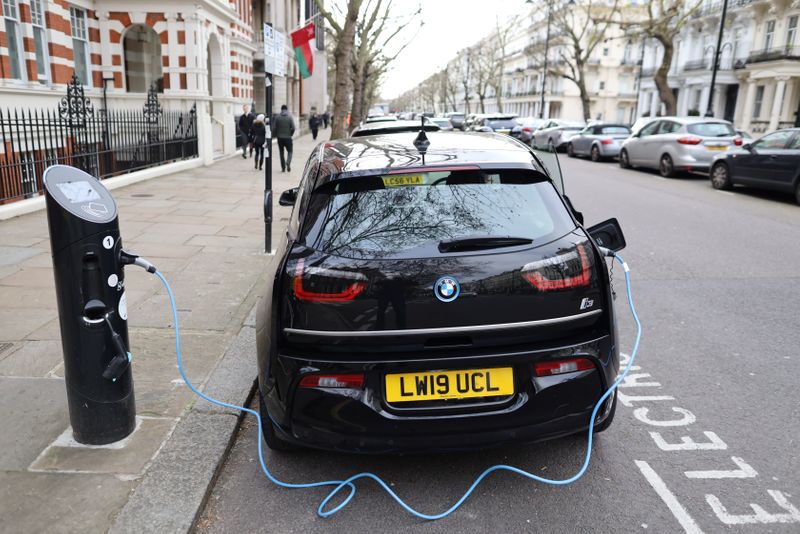 Electric car charges on a street in London