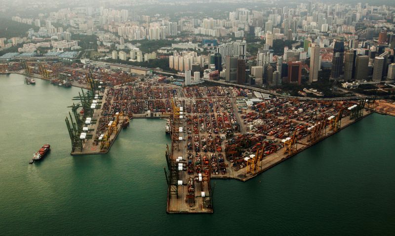 An aerial view of shipping containers stacked at the port