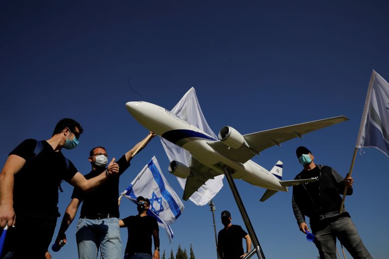 FILE PHOTO: Employees of Israeli flag carrier El Al Airlines