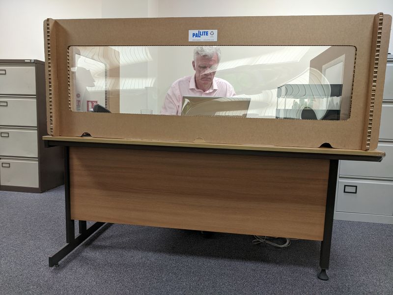 The CEO of Pallite, Iain Hulmes, works at his desk