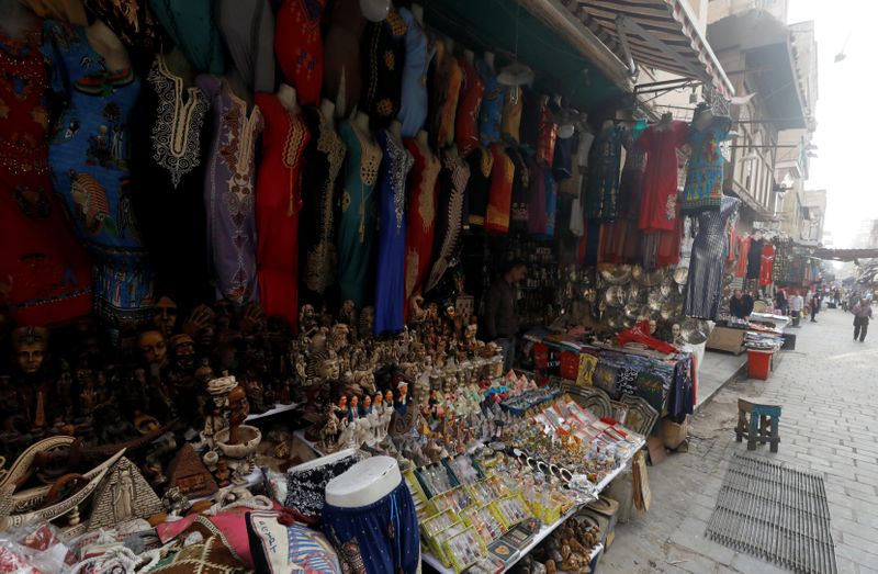 A shopkeeper waits for customers at a souvenir shop at