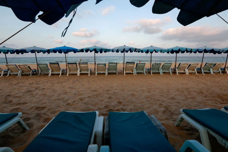 FILE PHOTO: Empty chairs are seen on a beach which