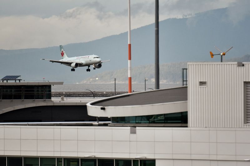 A plane lands at Vancouver International Airport in Richmond