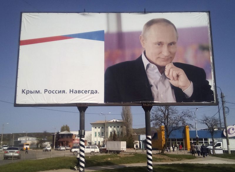 FILE PHOTO: A billboard with a portrait of Russian President