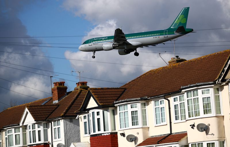 An Aer Lingus passenger aircraft arrives over the top of