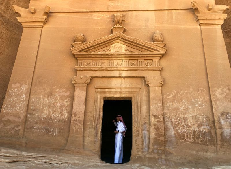 FILE PHOTO: A Saudi tour guide stands inside a tomb