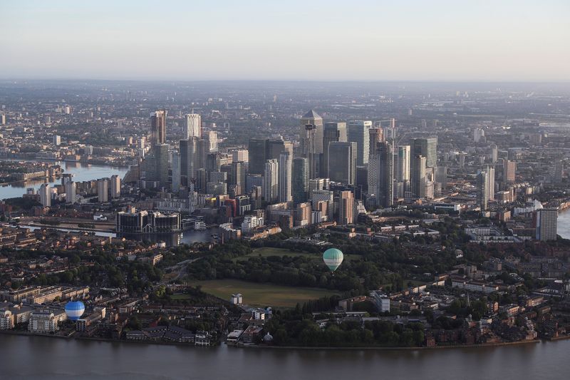 FILE PHOTO: Hot air balloons fly over the Canary Wharf