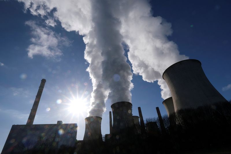 FILE PHOTO: Steam rises from the cooling towers of the