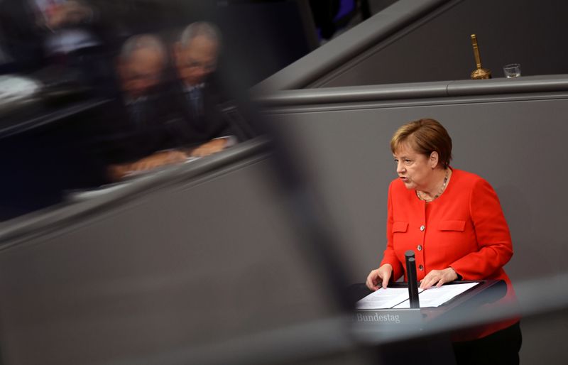 FILE PHOTO: German Chancellor Angela Merkel addresses the lower house