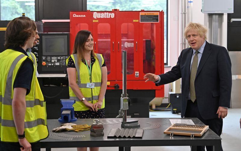 Britain’s Prime Minister Boris Johnson gestures as he speaks with