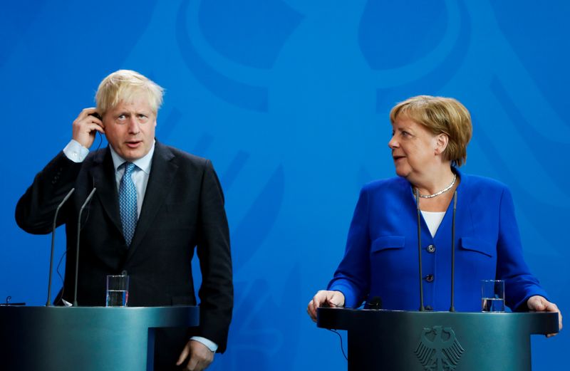 FILE PHOTO: German Chancellor Merkel meets Britain’s Prime Minister Johnson