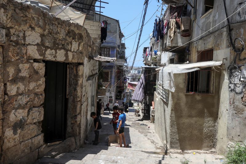 Boys play along an alleyway in Tripoli