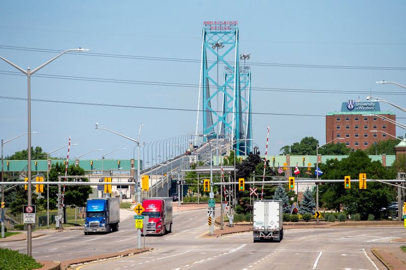 FILE PHOTO: Trucks traverse the Ambassador Bridge in Windsor