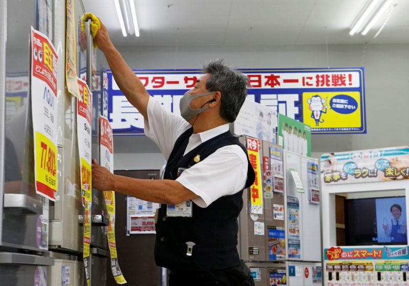 74-year-old store clerk Tadashi Sato works at the electronics retailer