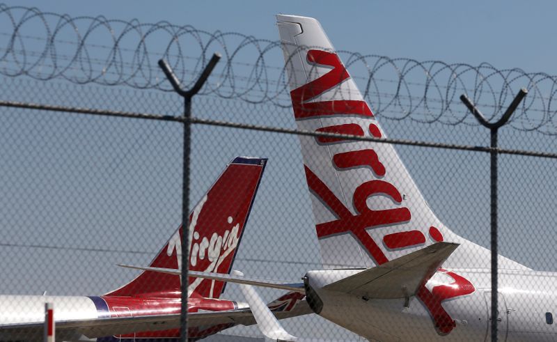 Virgin planes are parked next to each other at Kingsford