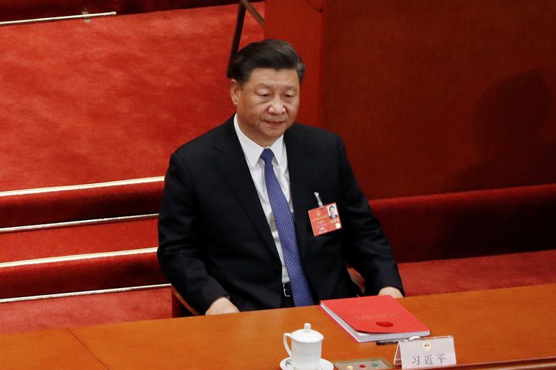 Chinese President Xi Jinping attends the closing session of NPC