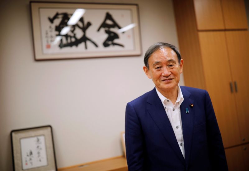 Japan’s top government spokesman Chief Cabinet Secretary Yoshihide Suga attends