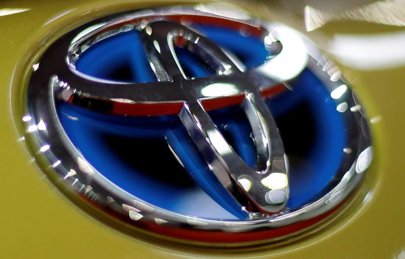 The logo of Toyota is seen on a car during