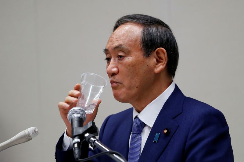 Yoshihide Suga, Japan’s Chief Cabinet Secretary attends a news conference,