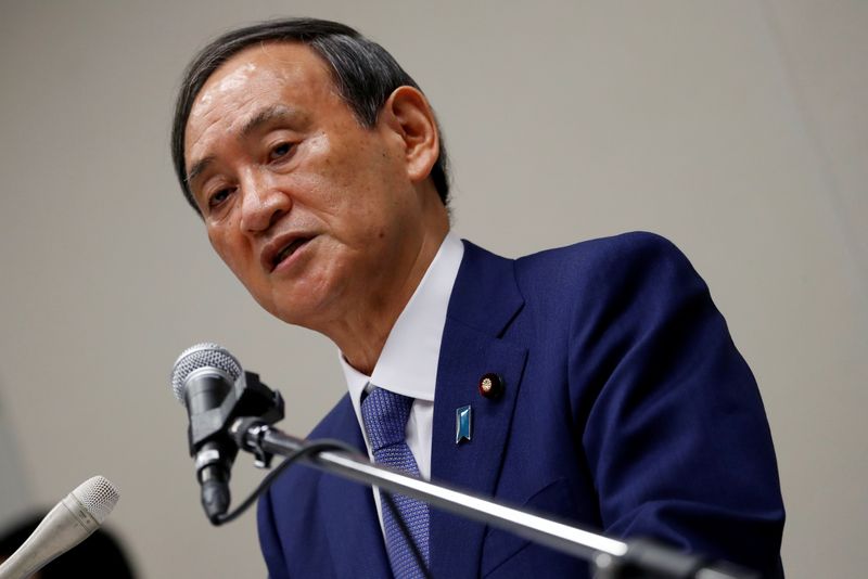 Yoshihide Suga, Japan’s Chief Cabinet Secretary attends a news conference,