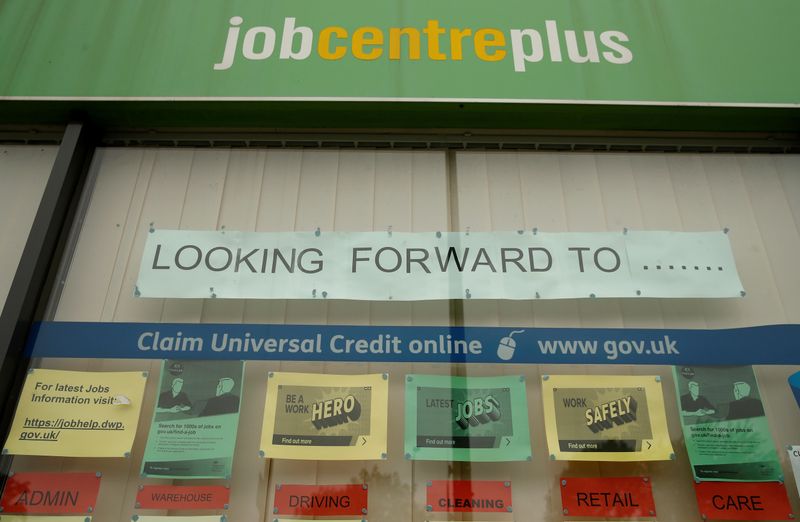 Job adverts are seen in the window of a job