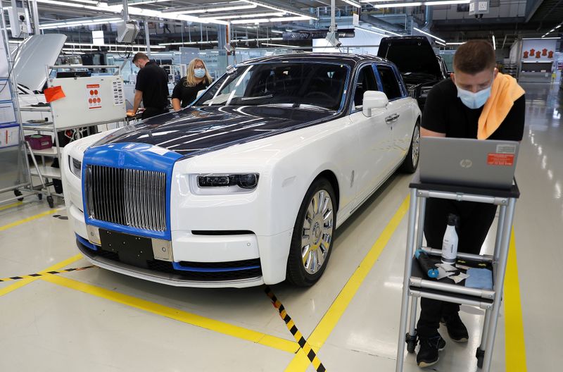 Technicians inspect a Rolls-Royce a car on the production line