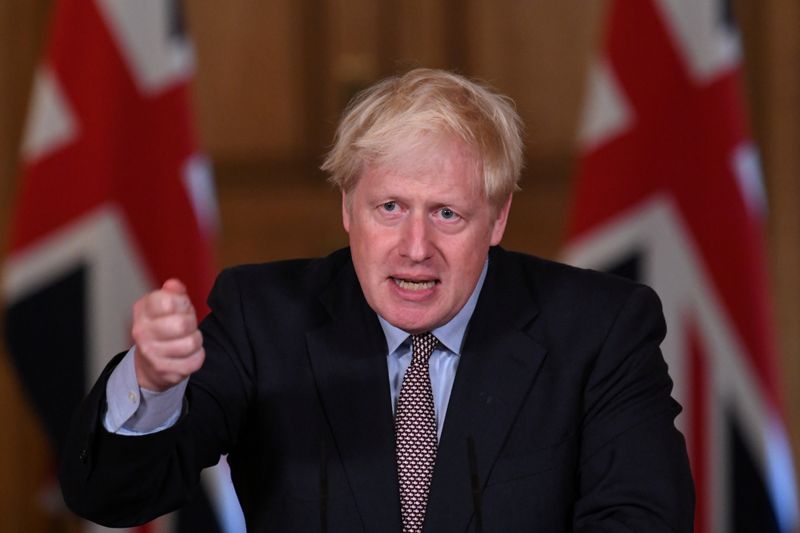 FILE PHOTO: Britain’s Prime Minister Boris Johnson holds a virtual