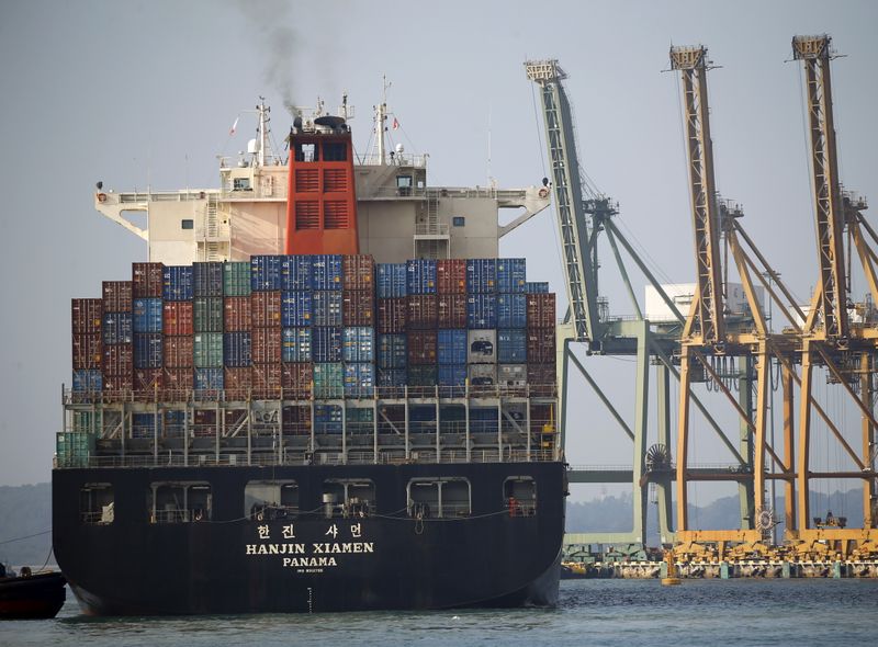 A ship prepares to dock at PSA’s Tanjong Pagar container