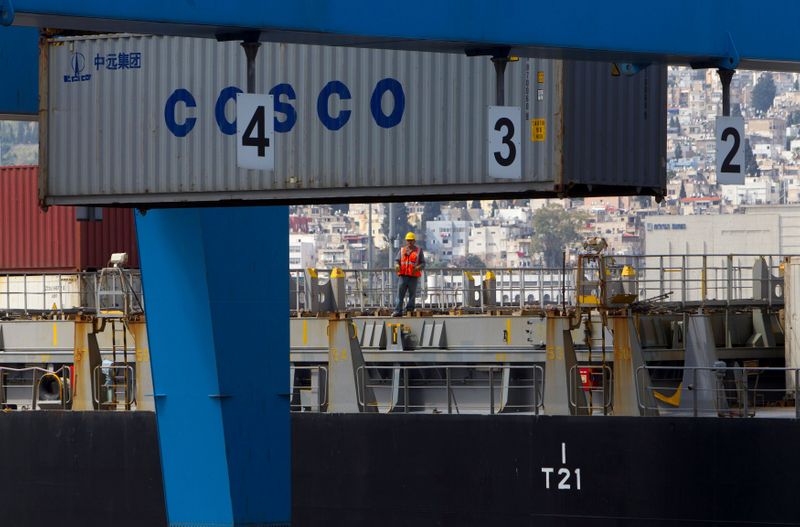 FILE PHOTO: A container is unloaded from a cargo ship