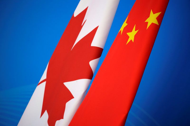 Flags of Canada and China are placed for the first