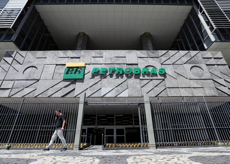 A man walks in front of the headquarters of Petroleo