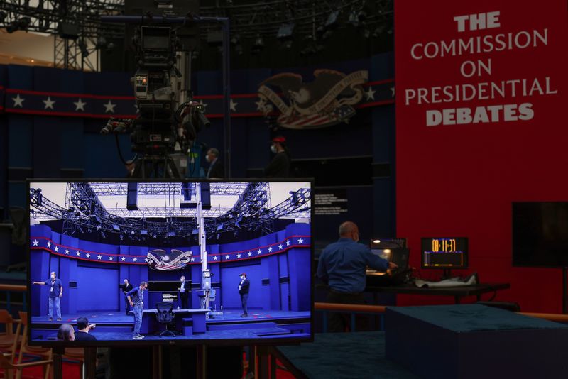 Workers prepare for the first presidential debate between U.S. President