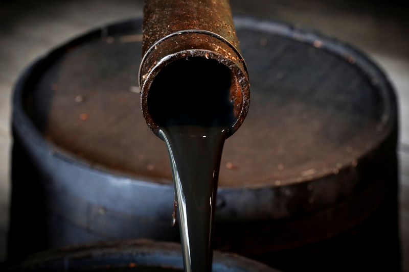 FILE PHOTO: Oil pours out of a spout from Edwin