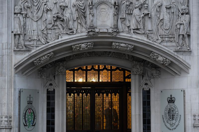 A member of security stands guard inside the Supreme Court