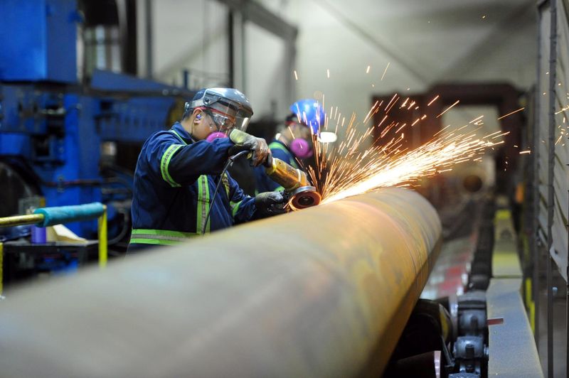 Workers are seen at Bri-Steel Manufacturing, a manufacturer and distributer