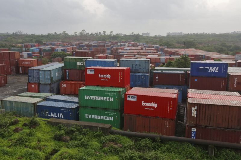 Cargo containers are seen stacked outside the container terminal of