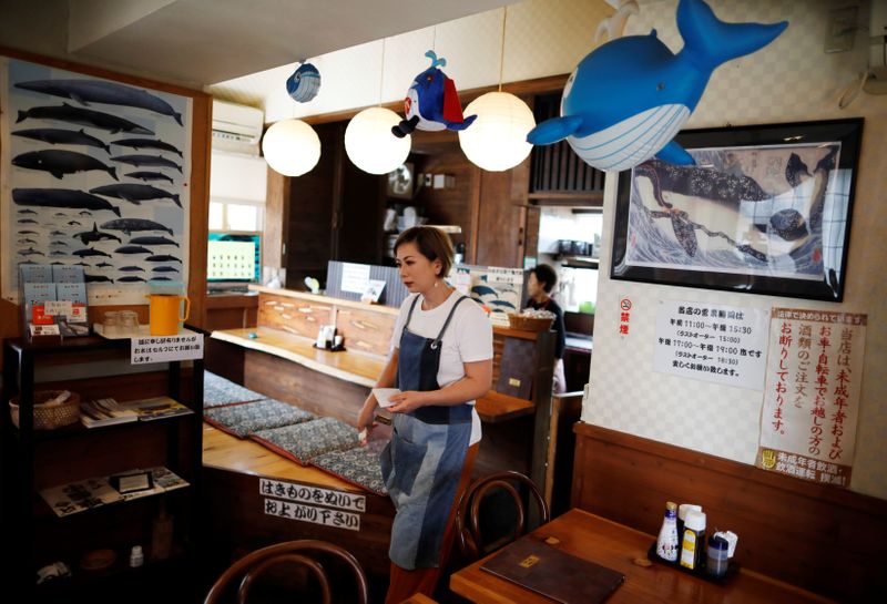 FILE PHOTO: Yoko Ichihara takes order from customers at her