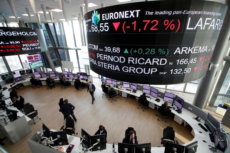 FILE PHOTO: Stock market operators work at the Euronext headquarters