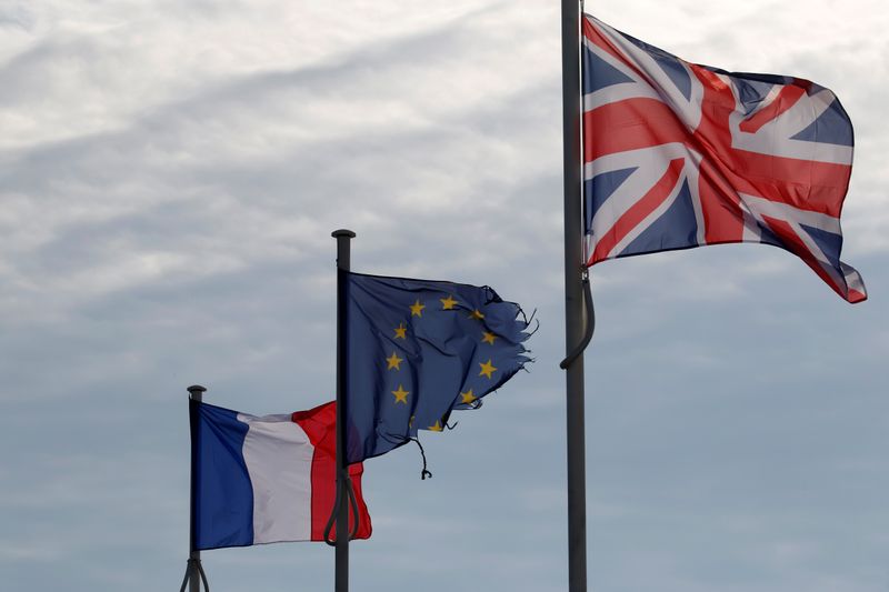 The French, British Union Jack and European flags are seen