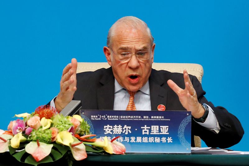 OECD Secretary-General Angel Gurria speaks at a news conference following