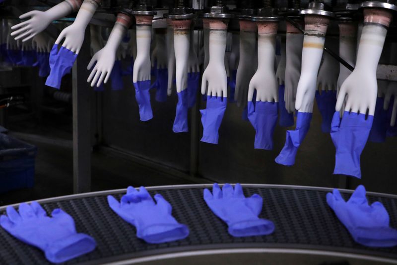 FILE PHOTO: Newly-made gloves are pictured inside Top Glove factory
