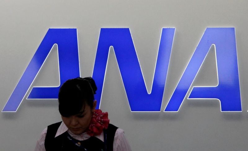An employee of All Nippon Airways works in front of
