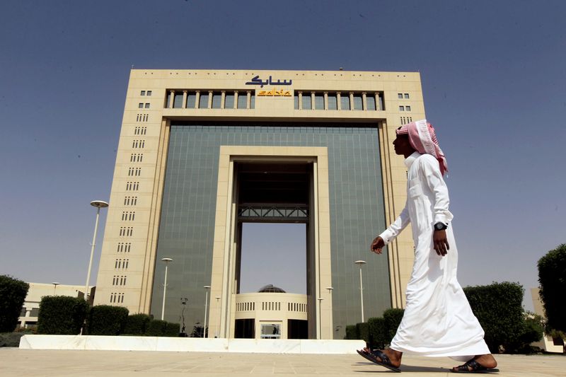 A man walks past the headquarters of Saudi Basic Industries