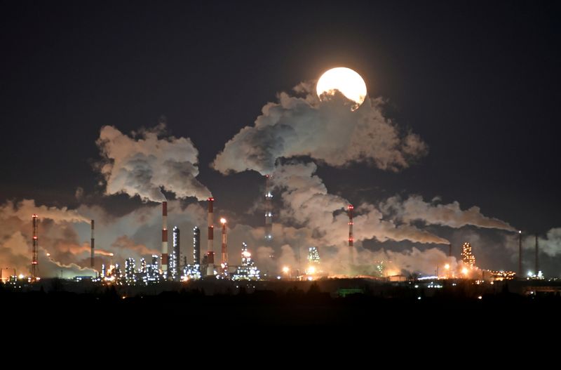FILE PHOTO: Full moon rises over the Gazprom Neft’s oil