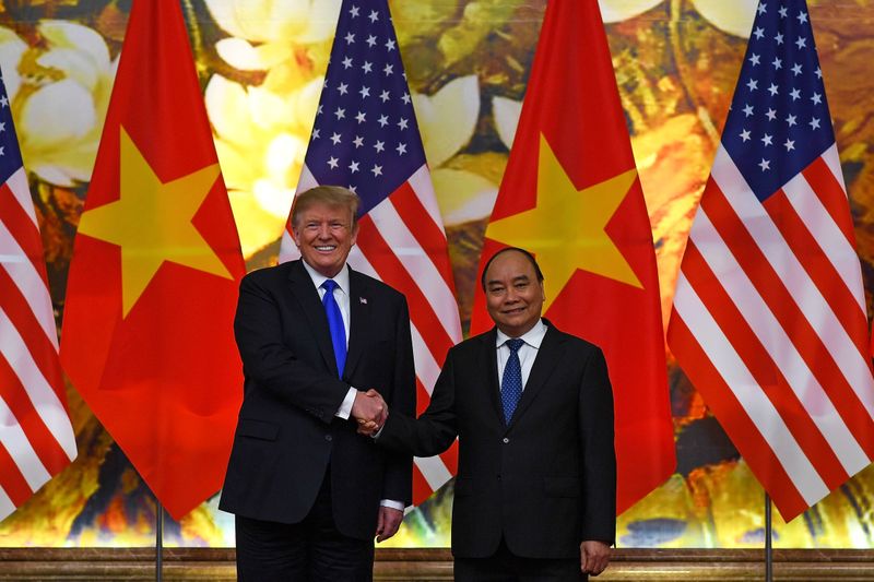 U.S. President Donald Trump shakes hands with Vietnamese Prime Minister