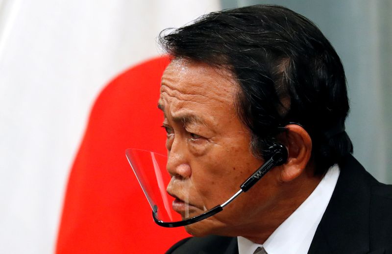 FILE PHOTO: Japan’s newly-appointed Finance Minister Taro Aso speaks at