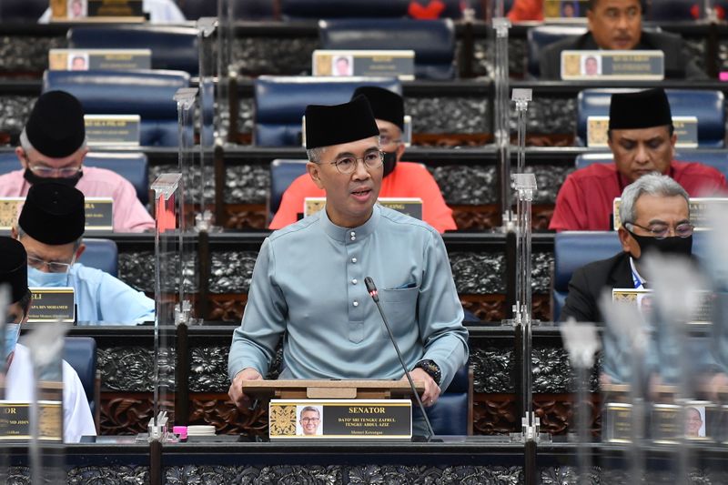 Malaysia’s Finance Minister Tengku Zafrul presents the 2021 budget at
