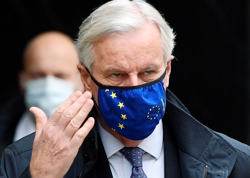 European Union’s chief Brexit negotiator Michel Barnier wearing a face